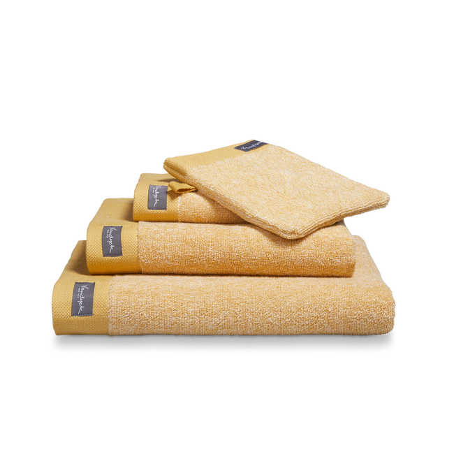 Home Mouliné honey gold handdoeken uit de Home serie zijn melange en afgewerkt met een stevige border. De handdoeken hebben een hoog absorberend vermogen en zijn verkrijgbaar in diverse maten. Home Mouliné handdoeken van Vandyck hebben een stoere look.