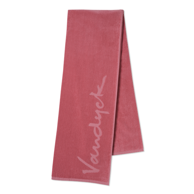 Ash rose strandhanddoek is effen roze met aan de zijkant het logo van Vandyck in een lichtere tint